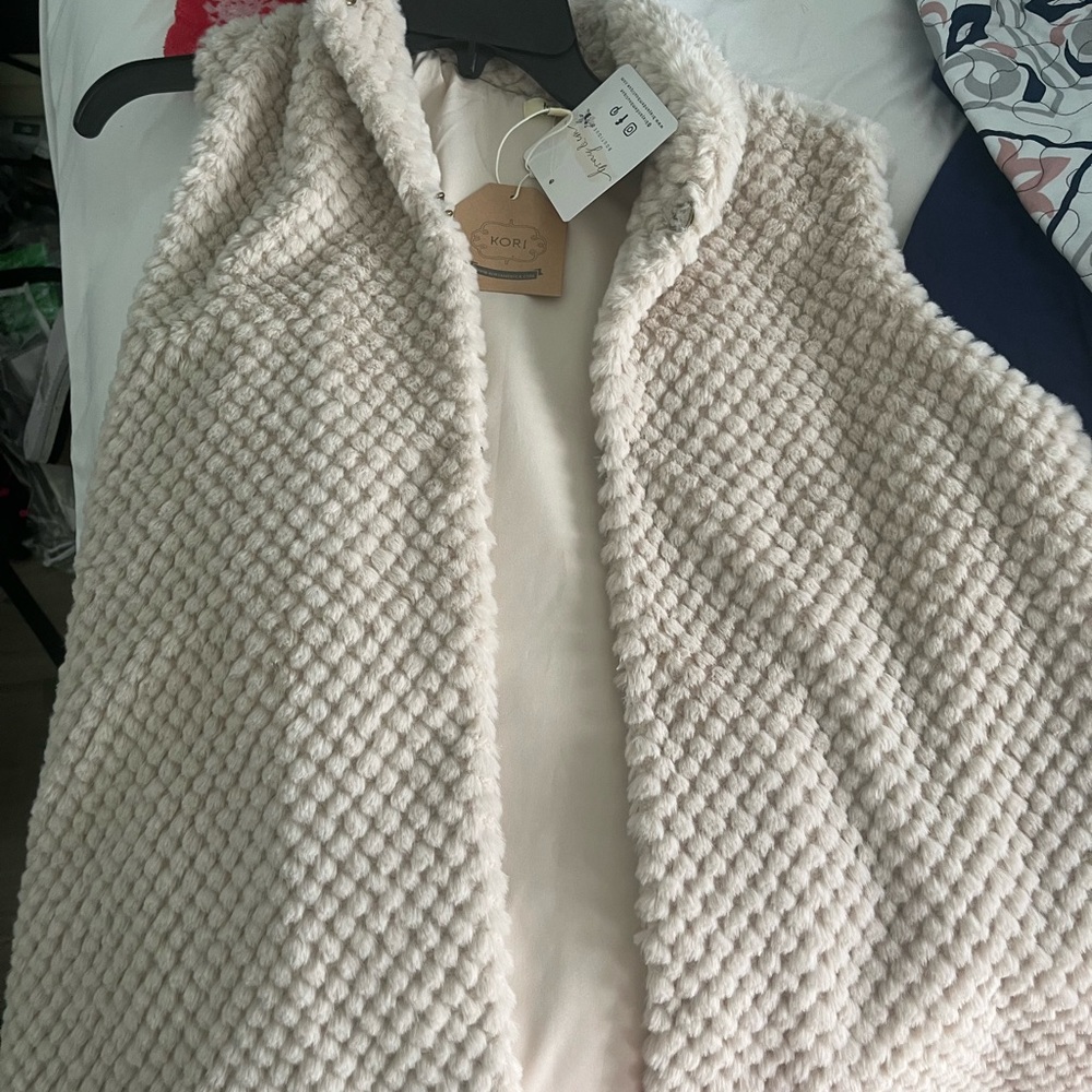 Faux fur vest fire small runs big. Brand new with tags